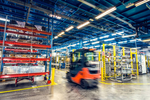 Lithium electric forklift driving around in a factory.